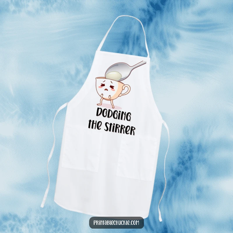 Funny apron showing a startled teacup with legs running away from a giant spoon, ideal for a cautious cook.