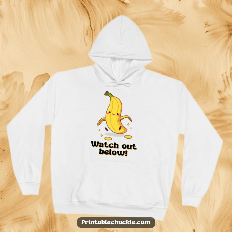 Funny banana peel hoodie showing a cartoon peel doing a dramatic pratfall, a hilarious slipping design.