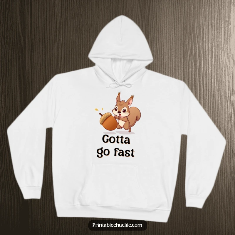 Funny startled acorn fleeing a determined squirrel, illustrated on a cozy hoodie, a humorous and warm funny gift.