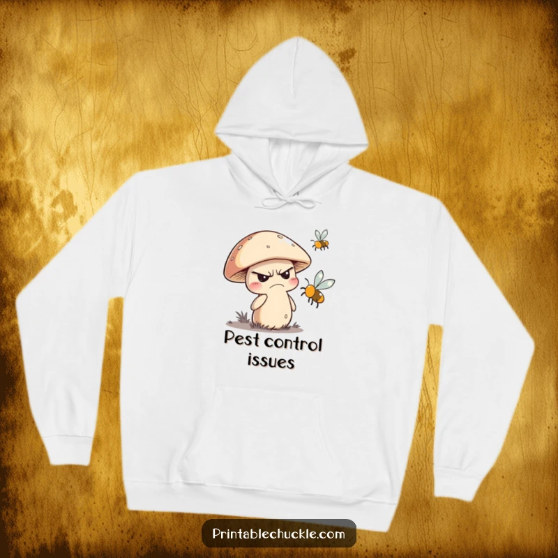 Funny hooded sweatshirt depicting a grumpy mushroom character in a forest setting, swatting at a buzzing fly.