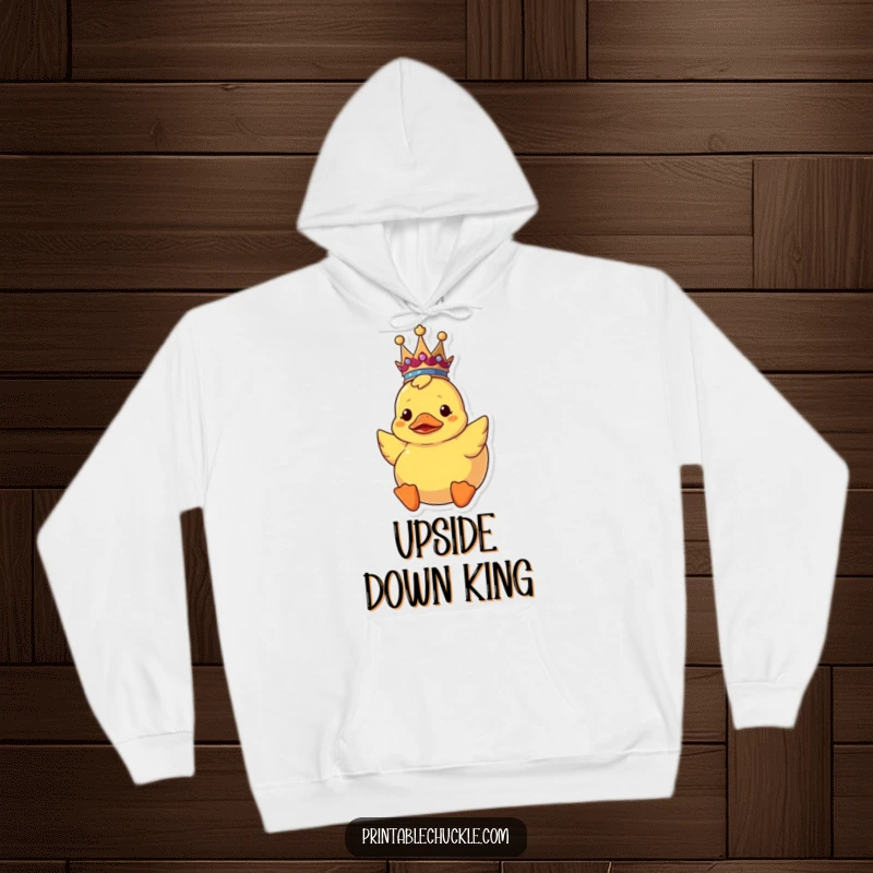 Funny upside down rubber duck hoodie wearing a crown, capturing a moment of royal confusion and comfort.