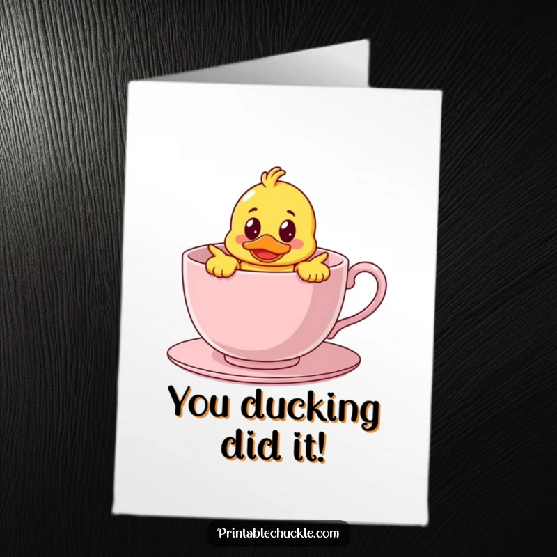 Funny free printable congratulations card with a bewildered rubber duck character humorously stuck inside a giant teacup.