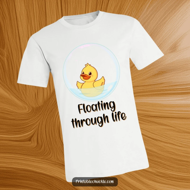 Funny Rubber Duck T-Shirt: A giggling rubber duck attempts to float on a giant bubble, conveying pure joy.