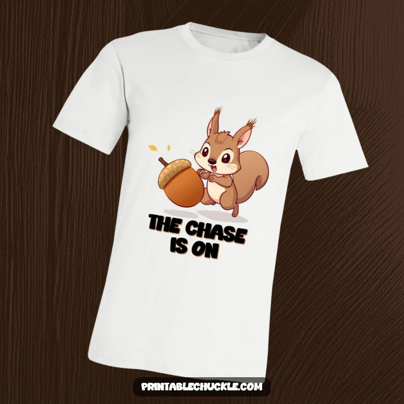 Funny startled acorn escaping a determined squirrel, depicted on a t-shirt, showcasing a funny chase, an ideal funny gift.